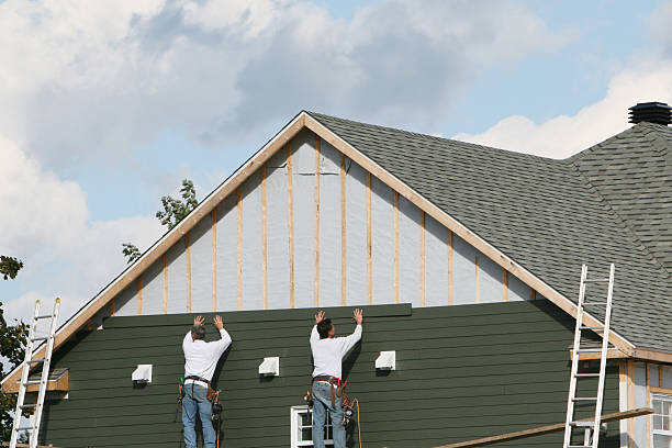 Professional Storm Damage Siding Repair technician working in Oakboro, NC